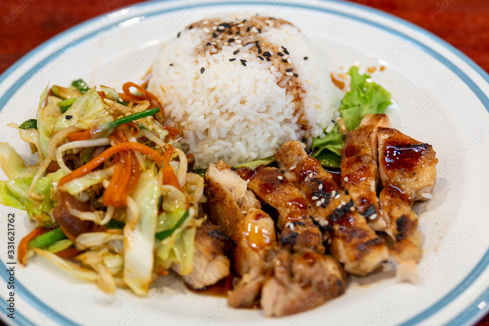 Chicken teriyaki with rice and stir fried vegetables. 