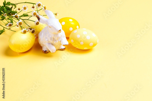 Sticker Yellow easter eggs with cute bunny on a yellow background.