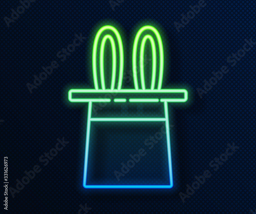 Glowing neon line Magician hat and rabbit ears icon isolated on blue background. Magic trick. Mystery entertainment concept. Vector Illustration