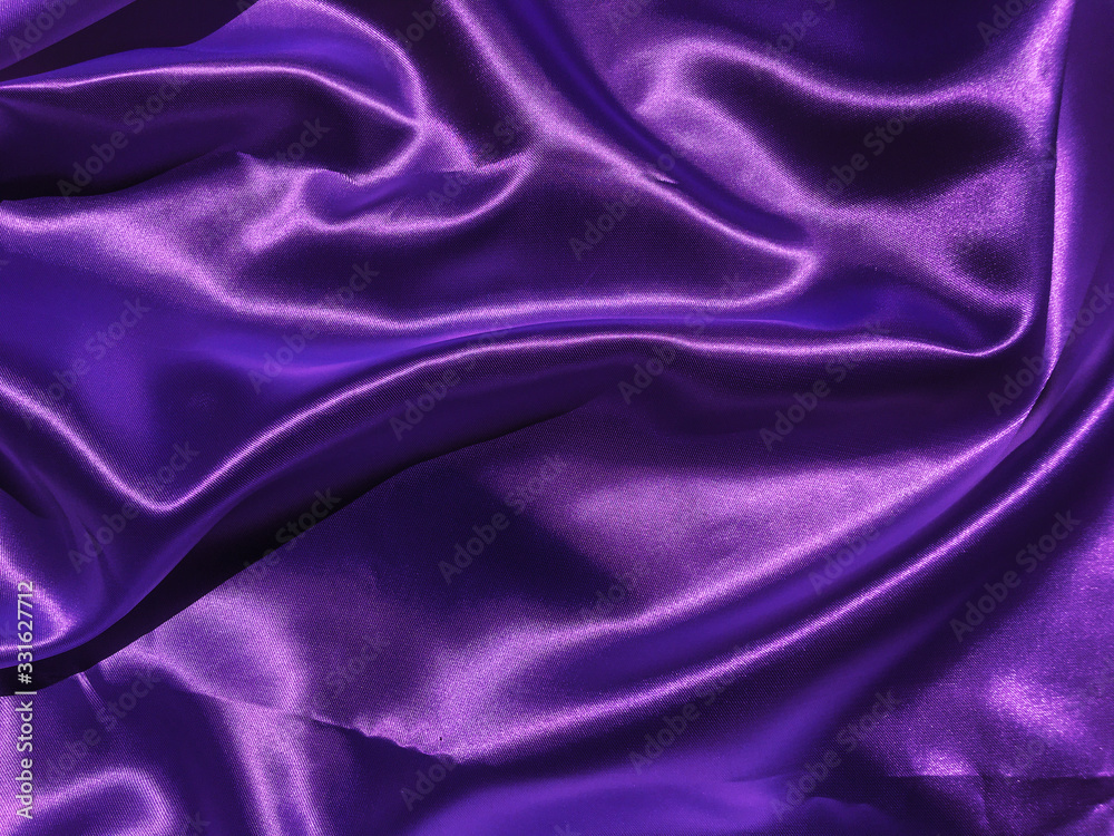 Smooth purple fabric or satin texture background with copy space for design Smooth purple fabric or satin texture background with copy space for design
