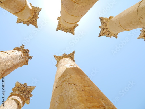 group of six columns of the ancient artemis temple on a sunny day, Jerash (Gerasa), kingdom Jordan, Middle East photo