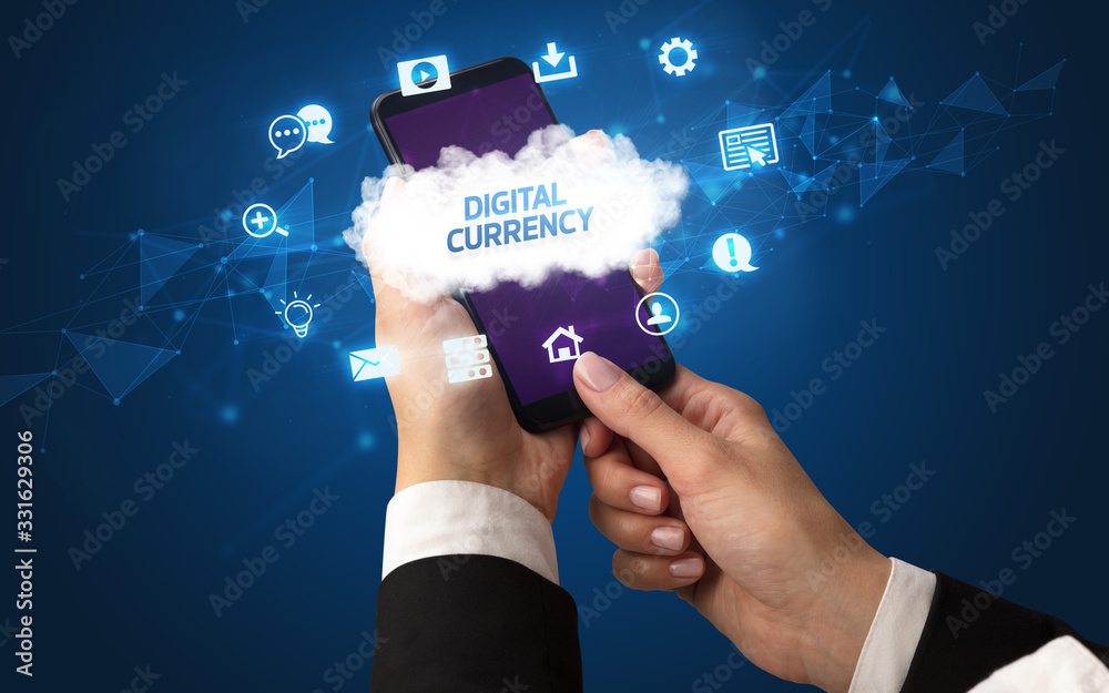 Female hand holding smartphone with DIGITAL CURRENCY inscription, cloud technology concept Female hand holding smartphone with DIGITAL CURRENCY inscription, cloud technology concept