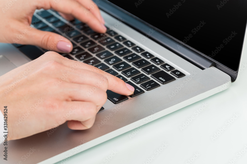 doctor's hand is typing the data into the system. Using a laptop computer doctor's hand is typing the data into the system. Using a laptop computer