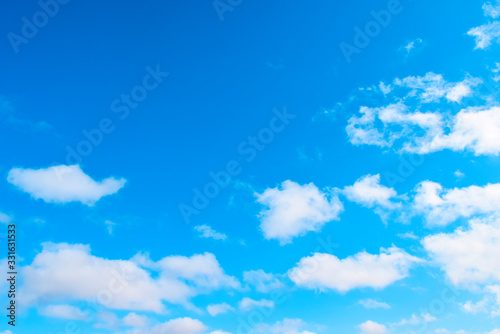 White, airy clouds on a blue sky