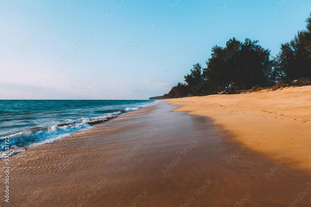 Landscape of tidal wave on the beach, gold sand, blue sky. Thailand.