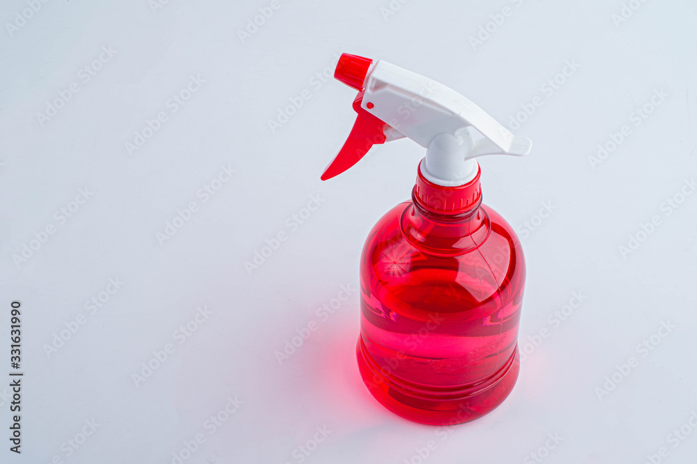 Red water foggy spray on white background. Red spray bottle. Red water foggy spray on white background. Red spray bottle.