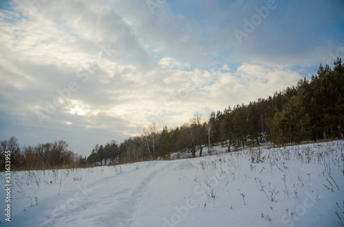 winter mountain landscape with snowy trees and blue sky © Александр Маланькин