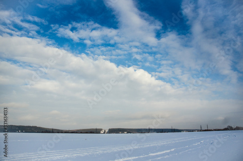 winter landscape with blue sky and clouds © Александр Маланькин