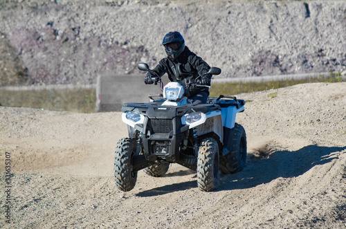 ATV driving on sand desert