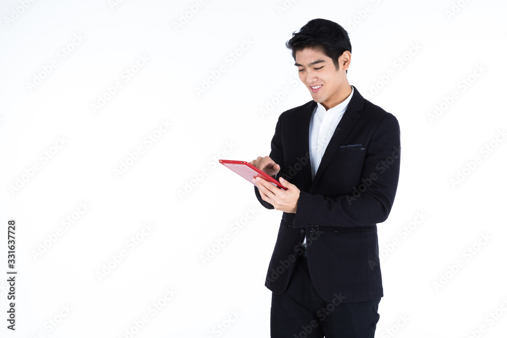 fashion handsome young Asian businessman using a tablet typing message guy isolated on white grey blank copy space studio background,indoor studio shoot fashion handsome young Asian businessman using a tablet typing message guy isolated on white grey blank copy space studio background,indoor studio shoot