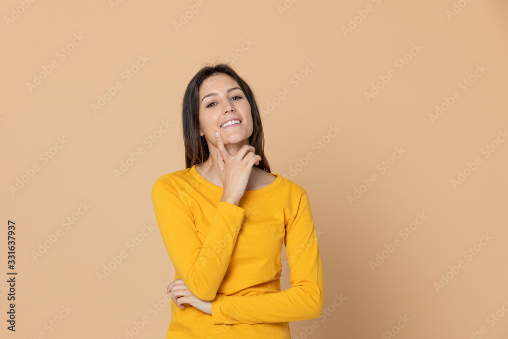 Attractive young girl wearing a yellow T-shirt Attractive young girl wearing a yellow T-shirt