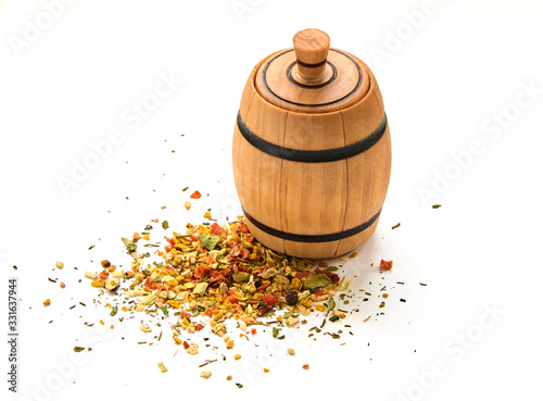 A mixture of peppers in a wooden jar