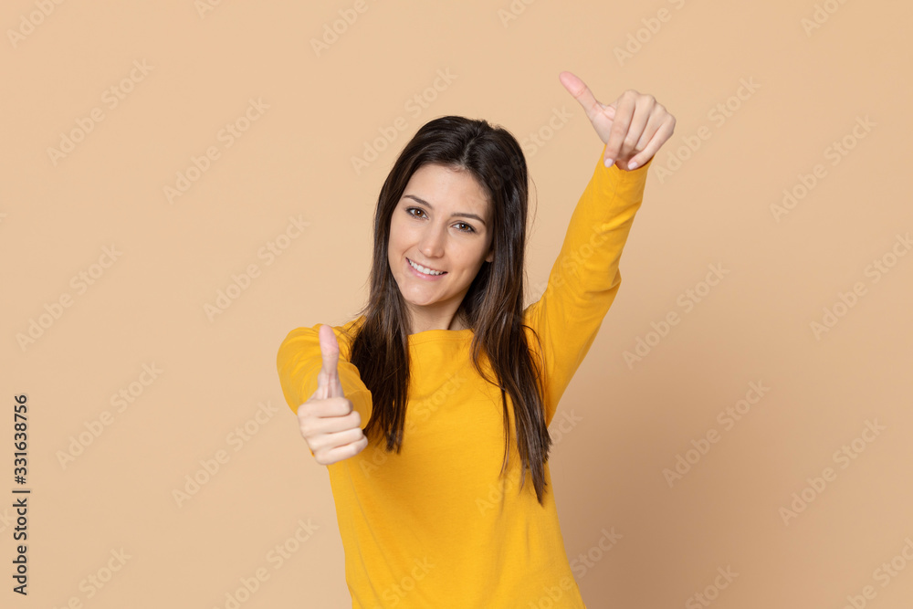 Attractive young girl wearing a yellow T-shirt Attractive young girl wearing a yellow T-shirt