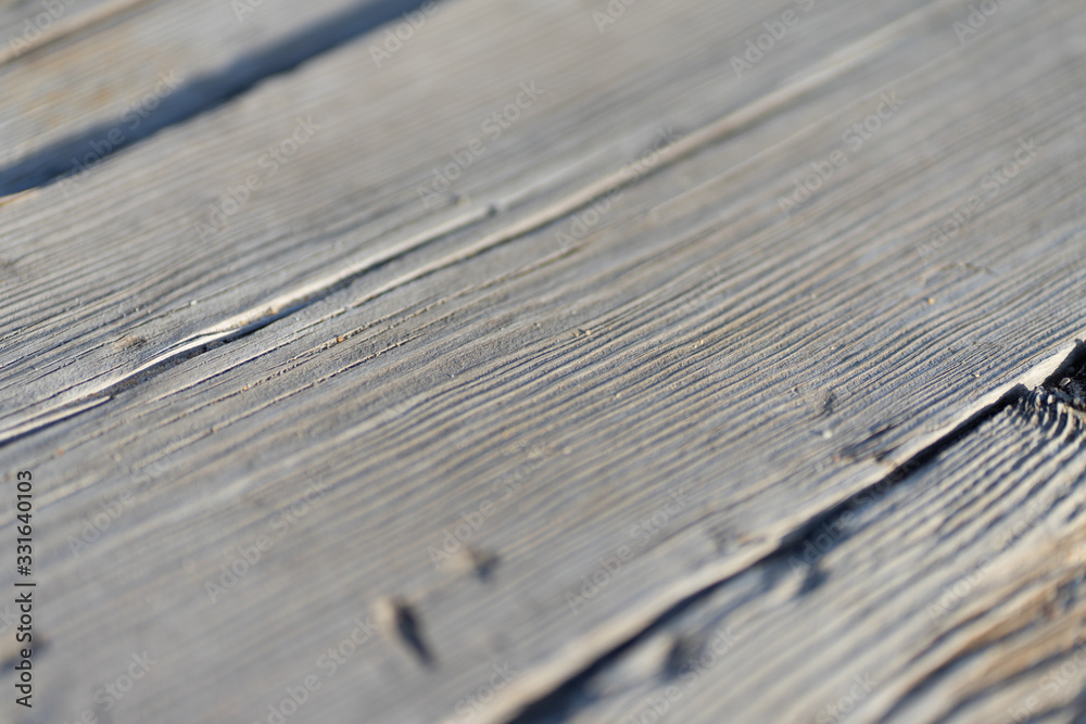 Natural gray wooden planks of a walking path Natural gray wooden planks of a walking path