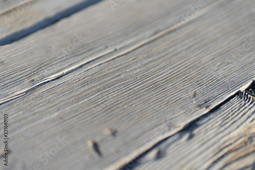 Natural gray wooden planks of a walking path