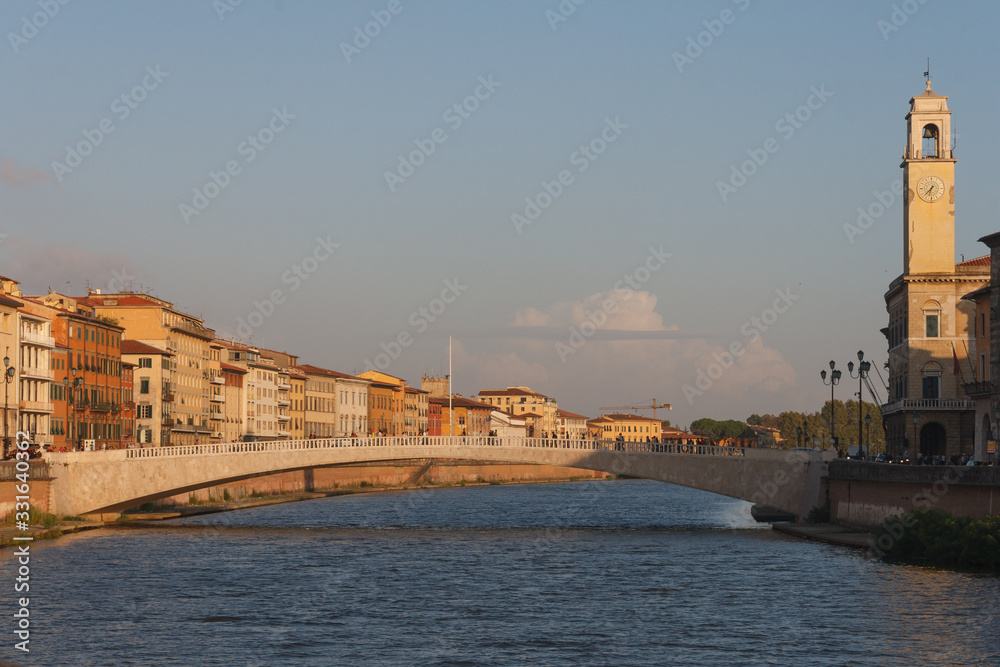 Pisa cityscape in summer day. The Tuscany region, central Italy, straddling the Arno river. Travel and touristic concepts.