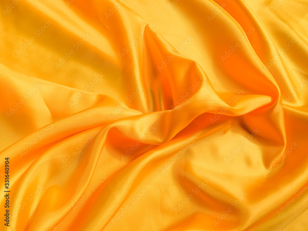 Yellow silk or satin texture background with copy space for design Yellow silk or satin texture background with copy space for design