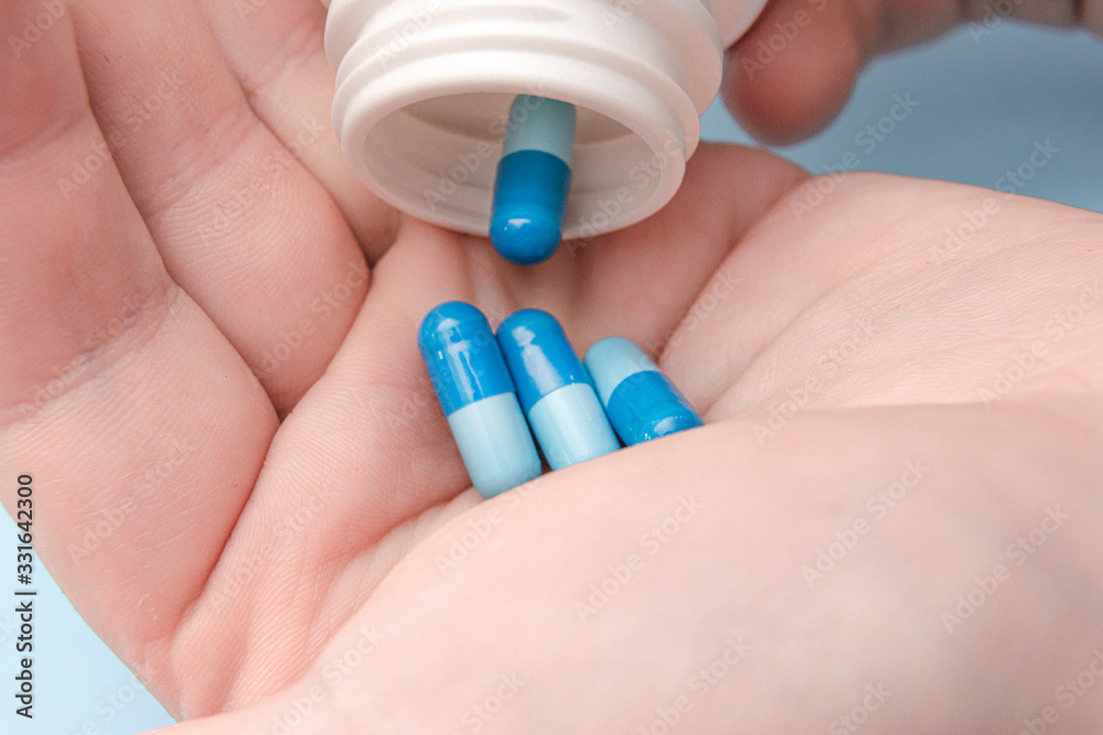 Colorful pills and medicines in the hand Colorful pills and medicines in the hand