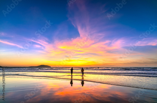 Landscape Pier fishing at Mui Ne beach in morning when silhouette fishermen prepare for a trip out to sea full of fish caught in central Vietnam