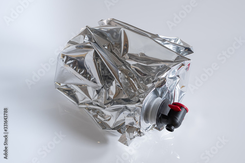 Crumpled plastic wine bag on white background