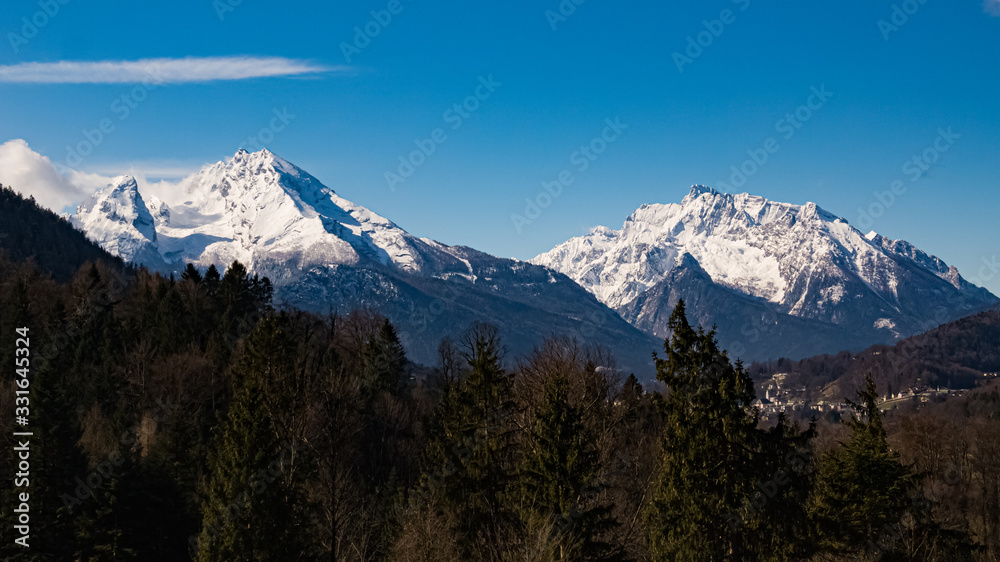 Beautiful winter landscape with the Watzmann and Hochkalter summits in the background near Berchtesgaden, Bavaria, Germany