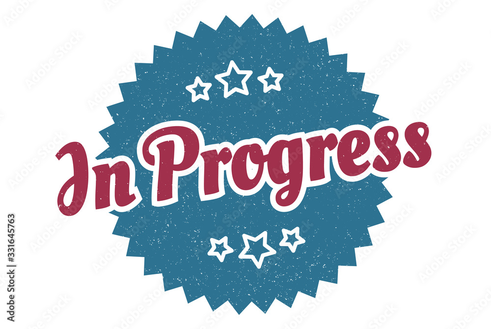 Fototapeta premium in progress sign. in progress round vintage retro label. in progress
