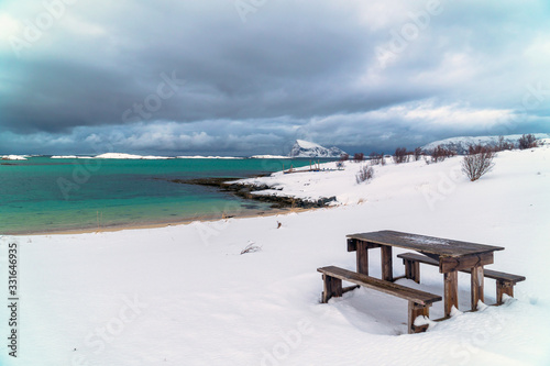 Snowy scenery in Northern Norway with a picnic table