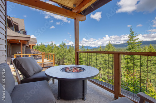 Photography Amazing balcony patio with fire pit and forest and mountains view