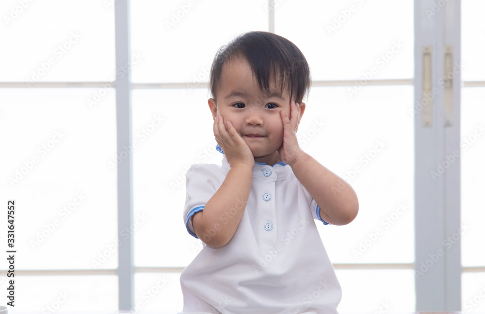 Curiosity Asian toddler lovely girl naughty cheerful play alone in father home office, smiling adorable daughter looking camera with happy sitting on table with office stationary background, happy kid Curiosity Asian toddler lovely girl naughty cheerful play alone in father home office, smiling adorable daughter looking camera with happy sitting on table with office stationary background, happy kid