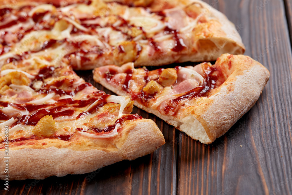 tasty pizza on the wooden background tasty pizza on the wooden background