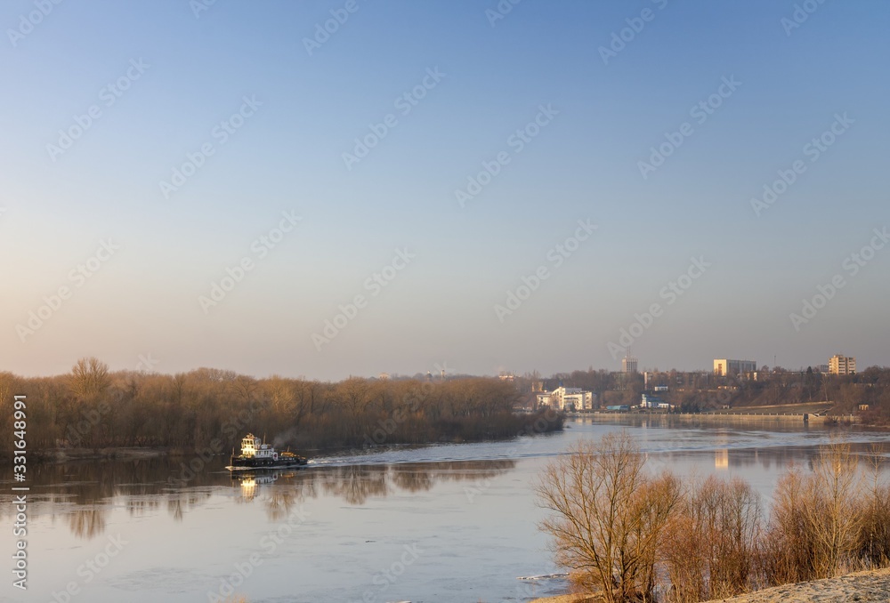 Boat tug goes on the morning river. Belarus Gomel