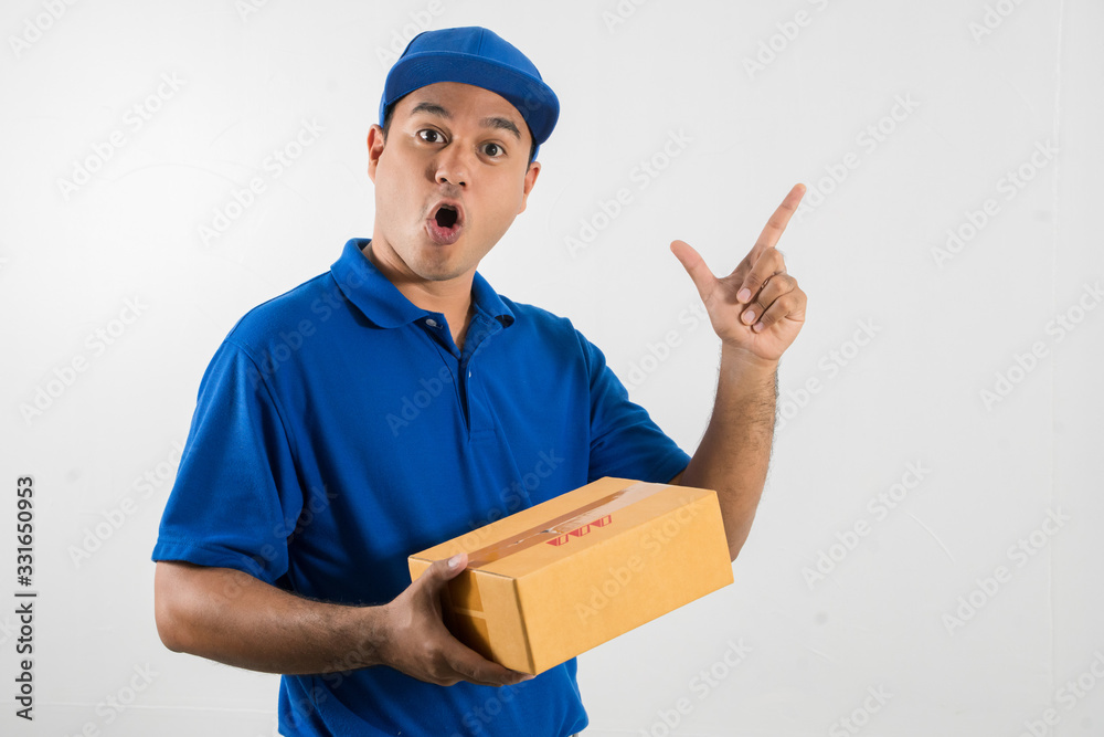 Blue Delivery handsome asian man holding parcel cardboard box on isolated white background.