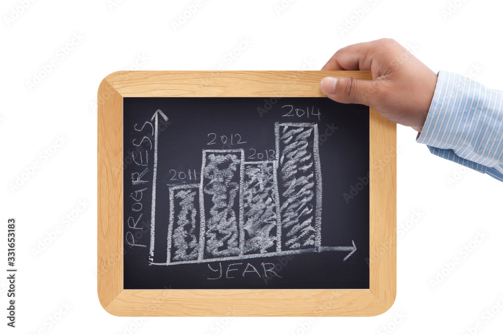 Close up of businessman holding chalkboard with word progress