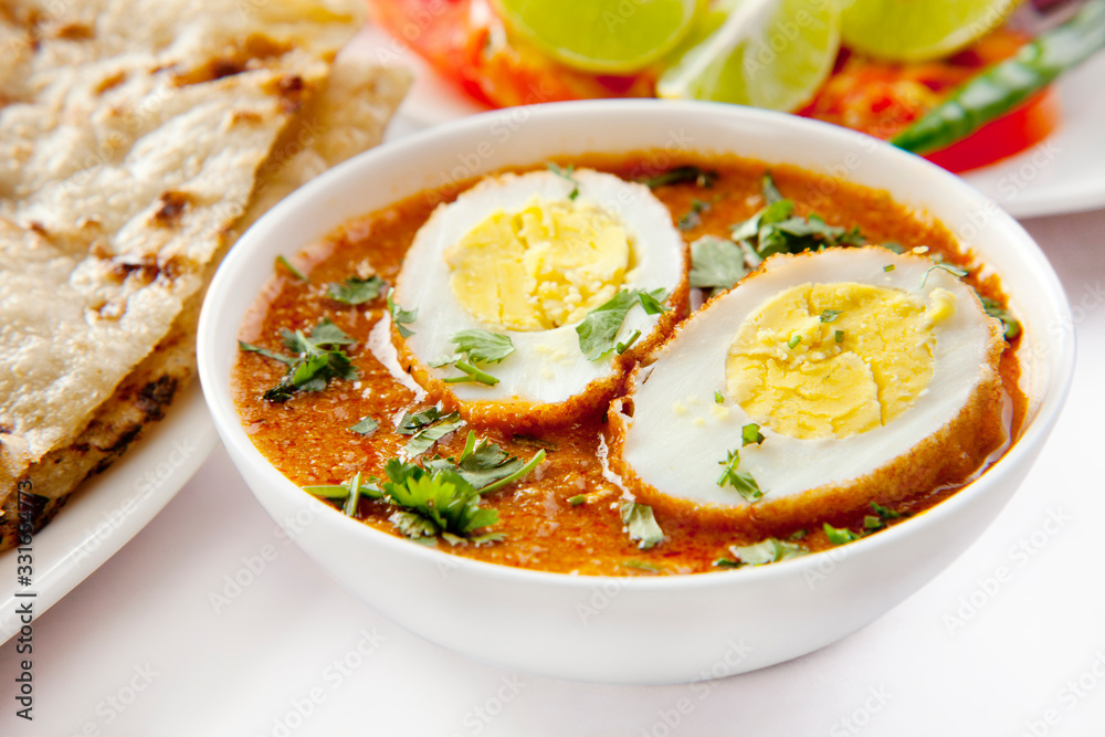 Simple egg curry with naan bread , indian food Simple egg curry with naan bread , indian food