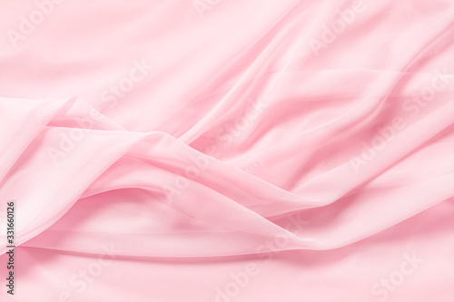 Tender pink silk draped fabric background