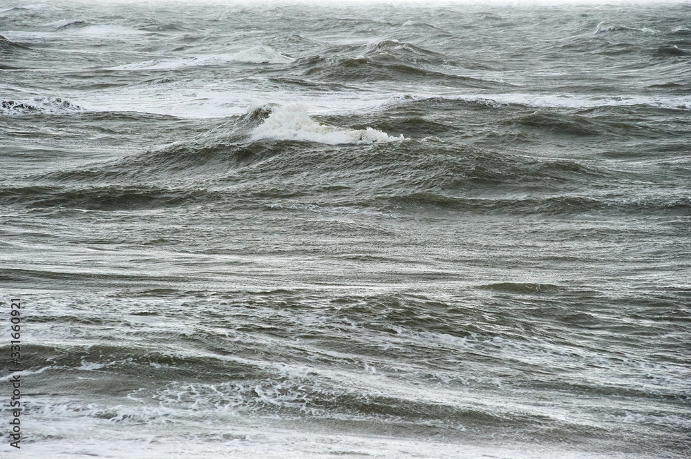 The Hague, South-Holland/Netherlands - 200226: Wild sea with waves on a stormy day