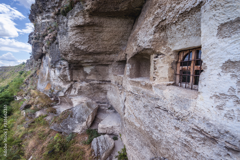 Exterior view of cave monastery in Orheiul Vechi natural and historical complex near Trebujeni village, Moldova