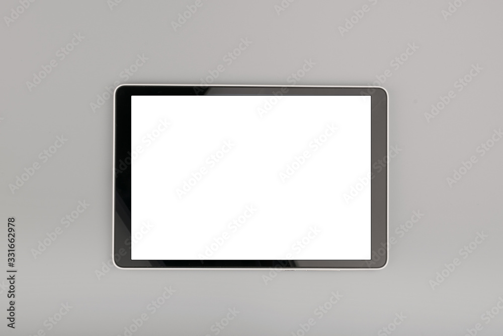 blank tablet computer on grey background blank tablet computer on grey background