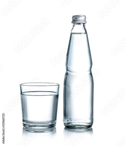 Glass water bottle and glass of water isolated on white background