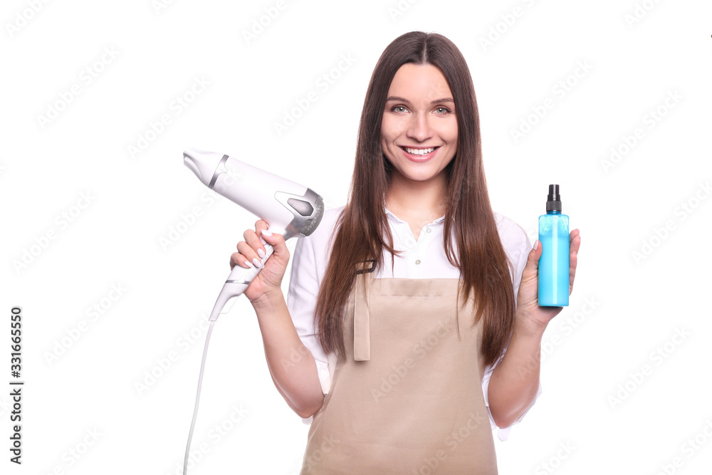 Young woman in apron isolated on white background. Hairdresser concept