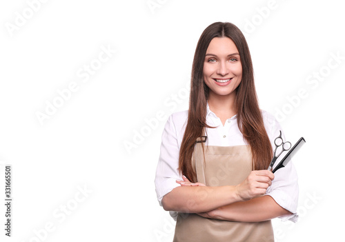 Young woman in apron isolated on white background. Hairdresser concept