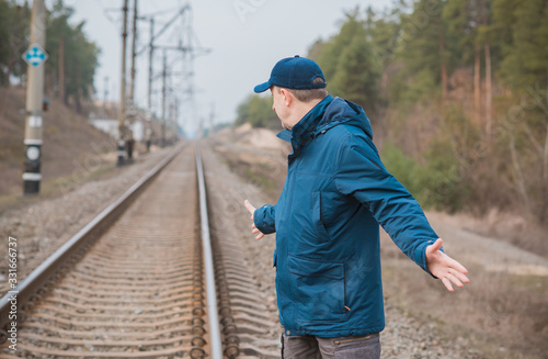 Wallpaper Mural Mature senior man on Railway, don't joke with rails  Torontodigital.ca