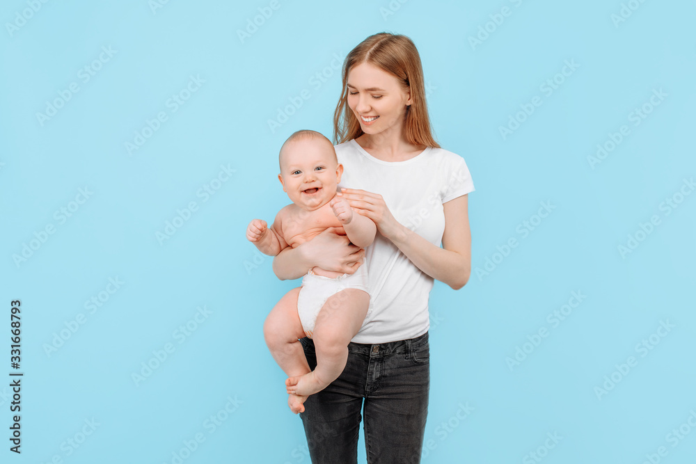 Happy family. young attractive mother with her adorable newborn son having fun Happy family. young attractive mother with her adorable newborn son having fun
