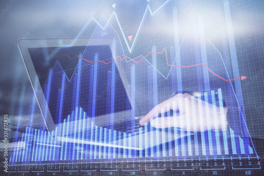 Double exposure of stock market graph with man working on laptop on background. Concept of financial analysis. Double exposure of stock market graph with man working on laptop on background. Concept of financial analysis.