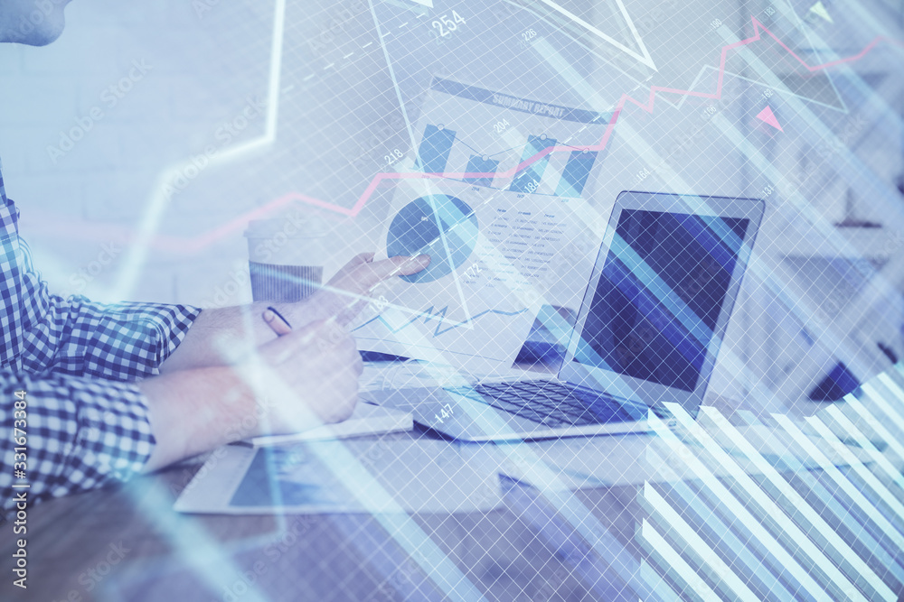 Multi exposure of financial graph with man works in office on background. Concept of analysis.