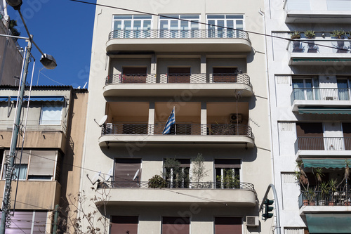 Fototapeta Naklejka Na Ścianę i Meble -  Flag of greece on the balcony of the house