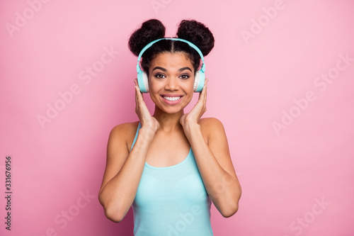 Close-up portrait of her she nice attractive lovely pretty charming cheerful cheery wavy-haired girl listening stereo sound radio melody isolated over pink pastel color background