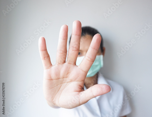 Women show stop hands gesture with her hands, stop corona virus.