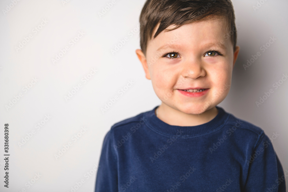 close portrait of a four years old boy over white close portrait of a four years old boy over white