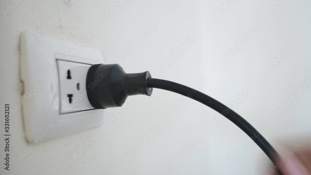 Hand close-up Disconnect the power cord from the wall socket. Hand close-up Disconnect the power cord from the wall socket.